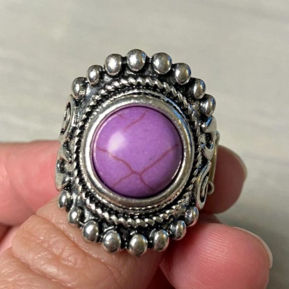 Silver ring with purple stone